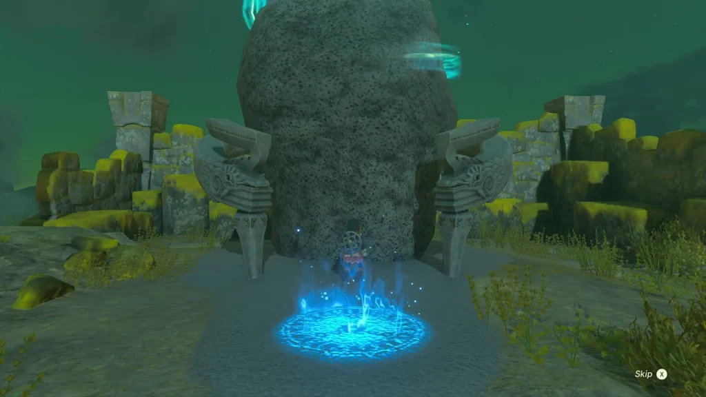 Shrine arch built into a tall rock with the blue entry platform in front
