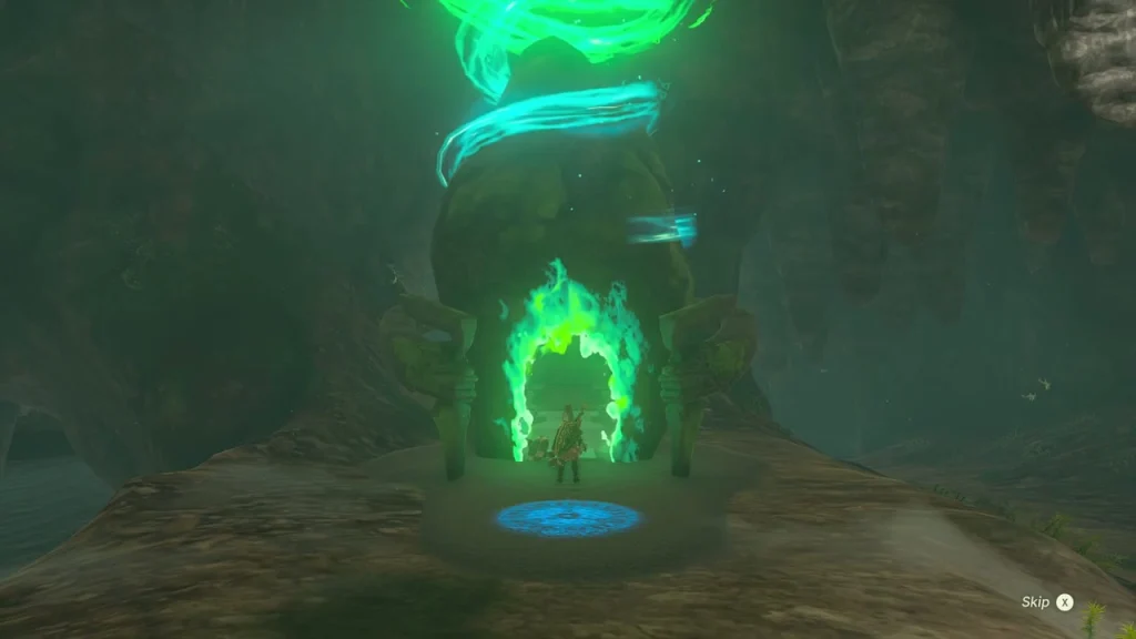 Green-flamed shrine gate with a blue travel platform inside the dark cave of Elma Knolls Well Green-flamed shrine gate with a blue travel platform inside the dark cave of Elma Knolls Well