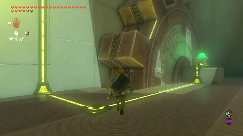 Large cog set into the wall with a yellow power line