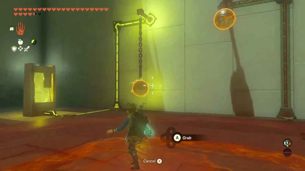 Metal ball on a chain grabbed with Ultrahand beside a glowing yellow rail