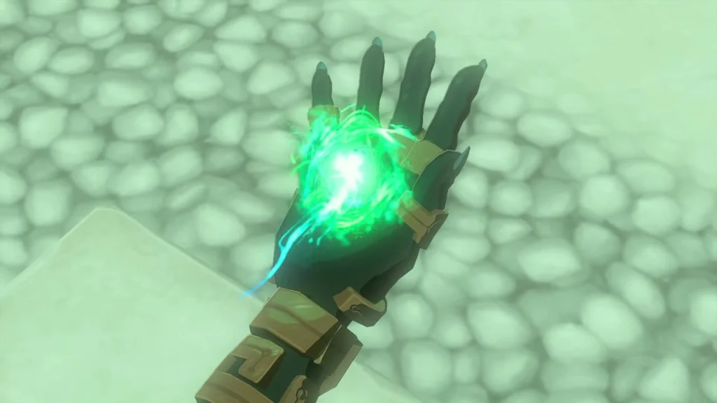 Green energy gathering in the palm of the right arm as Ultrahand is restored Green energy gathering in the palm of the right arm as Ultrahand is restored