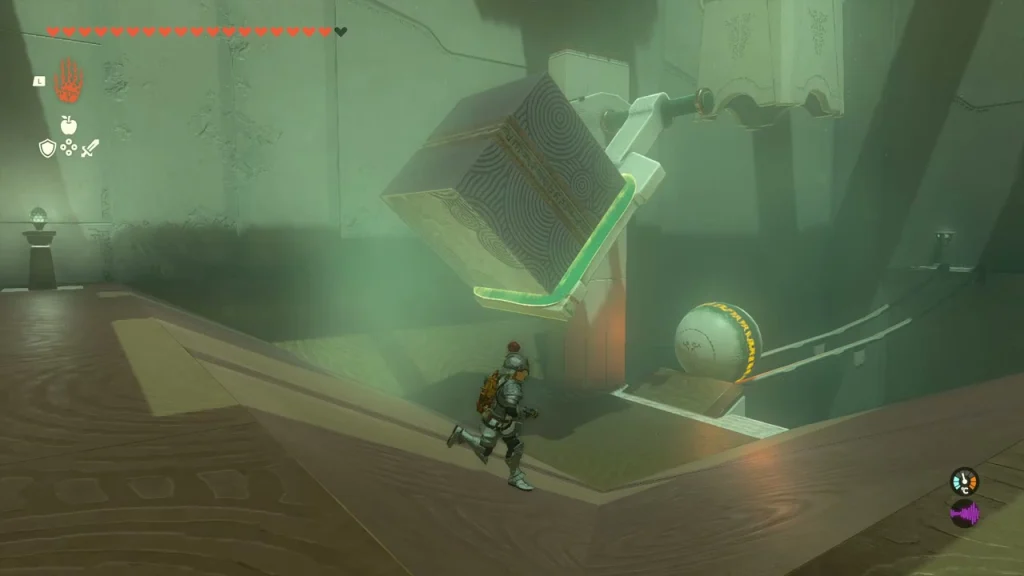 Heavy block swinging into a ball resting on a rail