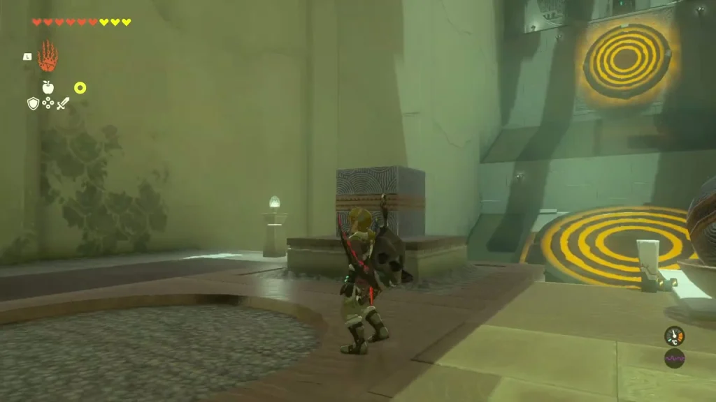 Heavy block on a ledge beside two round floor and wall targets