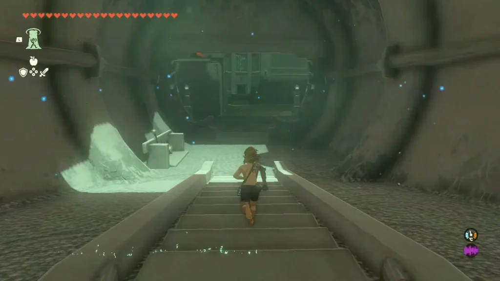 Long dark corridor leading down into the arena