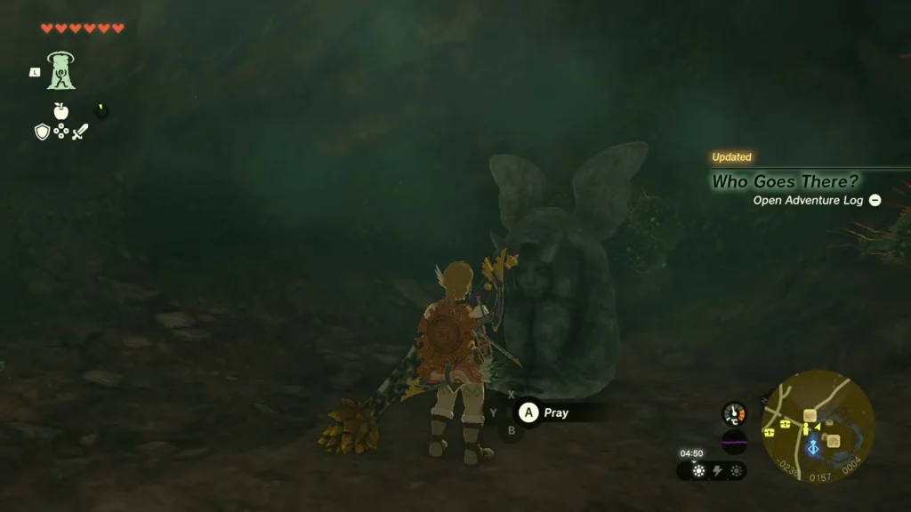 Horned Statue in a dark cave with the pray prompt shown Horned Statue in a dark cave with the pray prompt shown