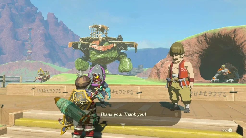 Kilton giving thanks in front of the Battle Talus sculpture Kilton giving thanks in front of the Battle Talus sculpture