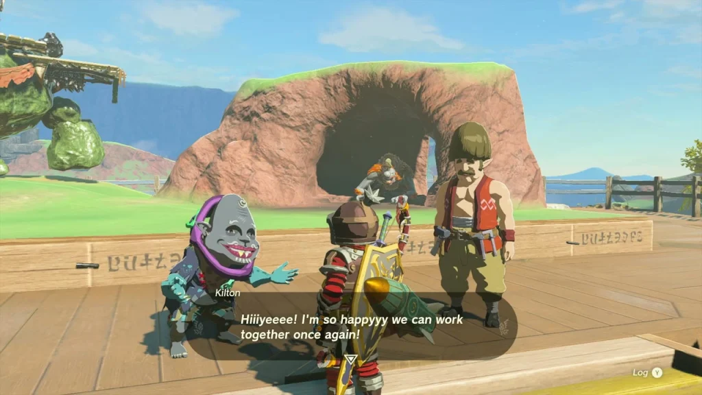 Kilton gesturing excitedly on the stage beside Hudson and the cliff cave Kilton gesturing excitedly on the stage beside Hudson and the cliff cave
