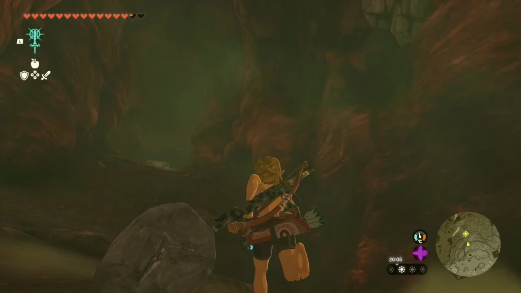 Dim cave interior with a large boulder after the last monsters fall
