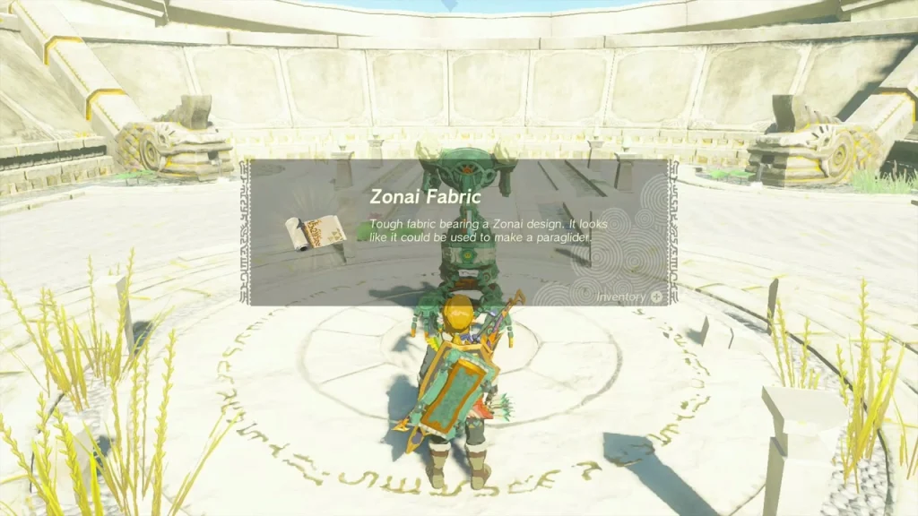 Zonai Fabric item box held in front of the Steward Construct Zonai Fabric item box held in front of the Steward Construct