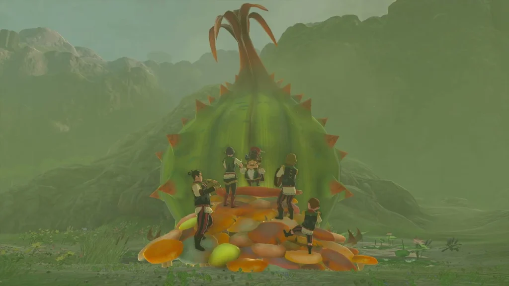 Troupe playing on a bed of mushrooms in front of the closed flower bud