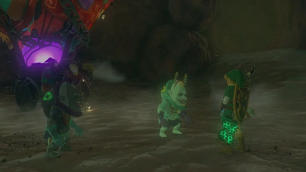 Kilton standing beside the stall in the dim cave