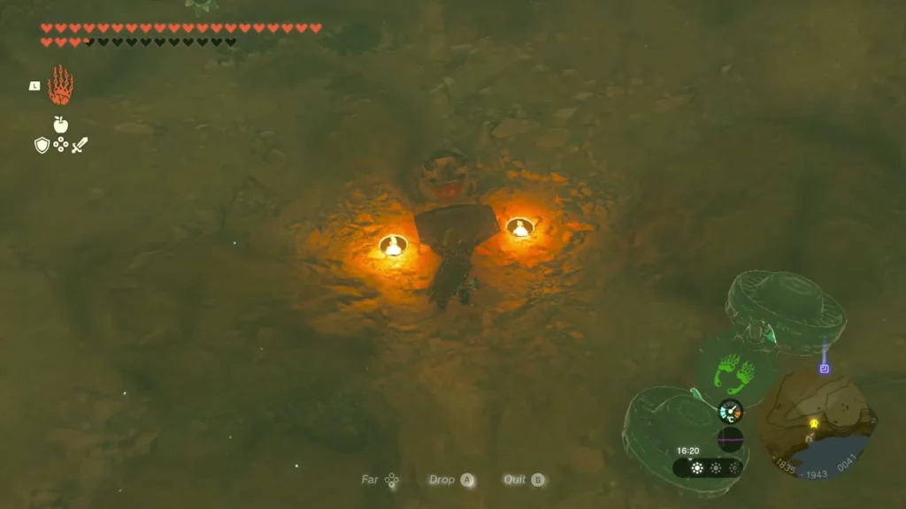 Yiga frog statue with two lit bowls in a dark cave chamber Yiga frog statue with two lit bowls in a dark cave chamber