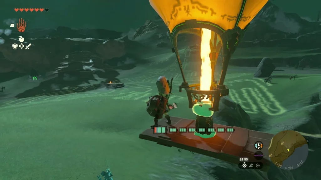 Platform craft with a lit balloon rising over the field