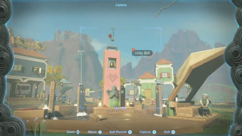 Camera viewfinder framing the Unity Bell above the Goddess Statue plaza with the bell tagged Camera viewfinder framing the Unity Bell above the Goddess Statue plaza with the bell tagged