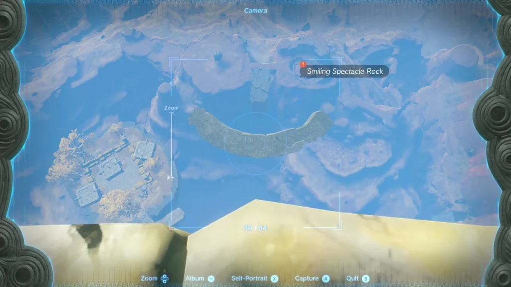 Camera view looking straight down at the crescent smile of Spectacle Rock with its tag