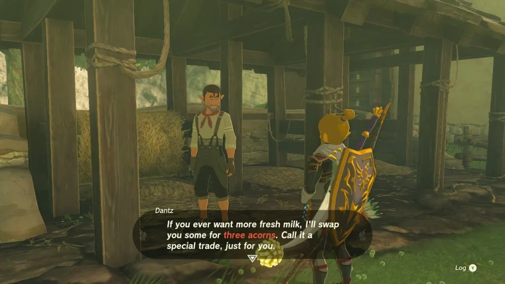 Dantz offering fresh milk for three acorns inside the barn