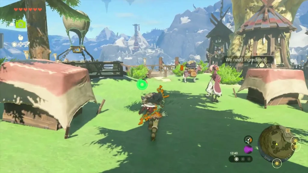 Grassy plateau with tents and a hot-air balloon overlooking the buildings of Rito Village