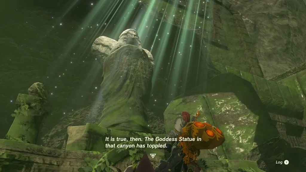 Toppled Mother Goddess Statue lying on its side under beams of light