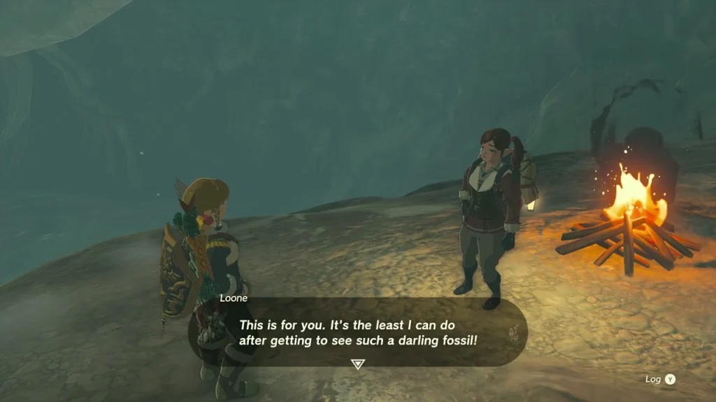 Loone beside the campfire after the fin and spine are back in place