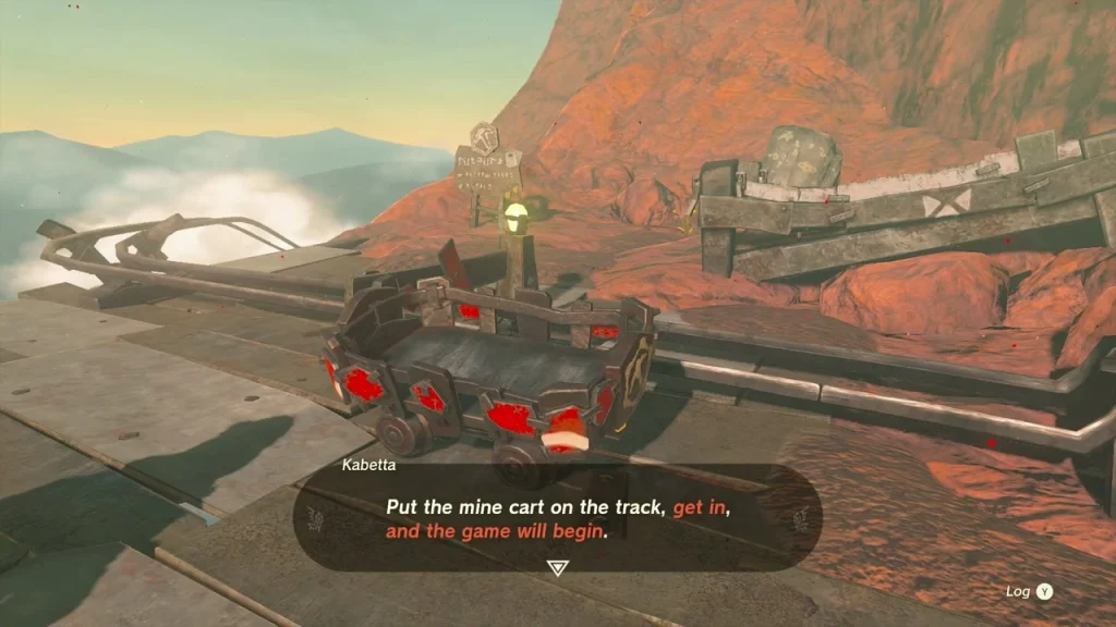 Mine cart on the rails with red fan mounts at the summit