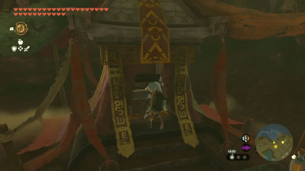 Chest inside the opened hidden room beneath red banners Chest inside the opened hidden room beneath red banners