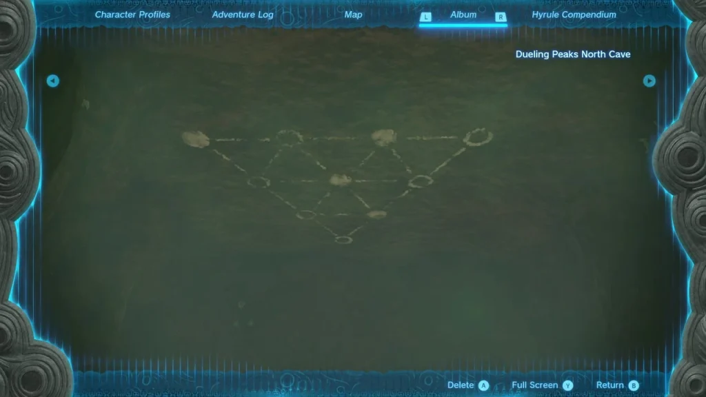 Photo of a triangle of chalk circles on the cave ceiling