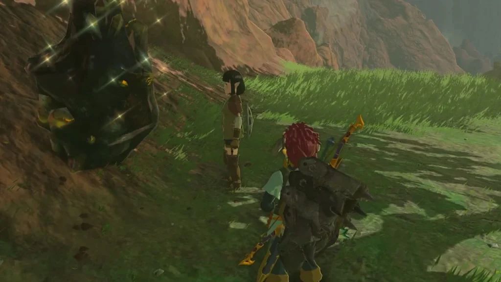 Large dark ore deposit embedded in a grassy hillside beside the quest giver Large dark ore deposit embedded in a grassy hillside beside the quest giver