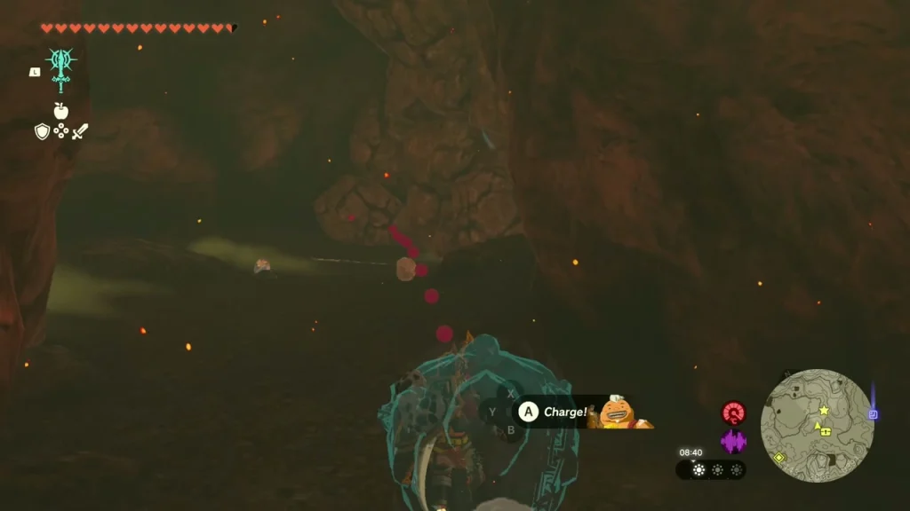 Yunobo rolling to break the wall with red debris flying