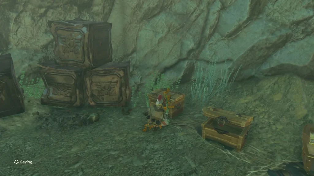 Opened chests against the rock wall behind stacked crates in the fort Opened chests against the rock wall behind stacked crates in the fort