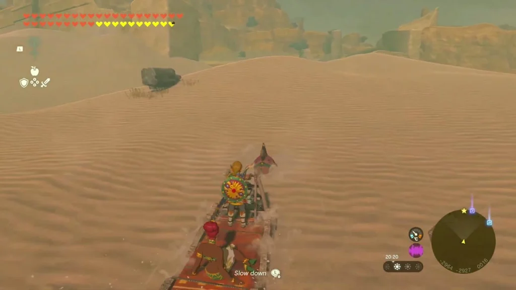 Sleigh seal sliding over open sand toward the ruins