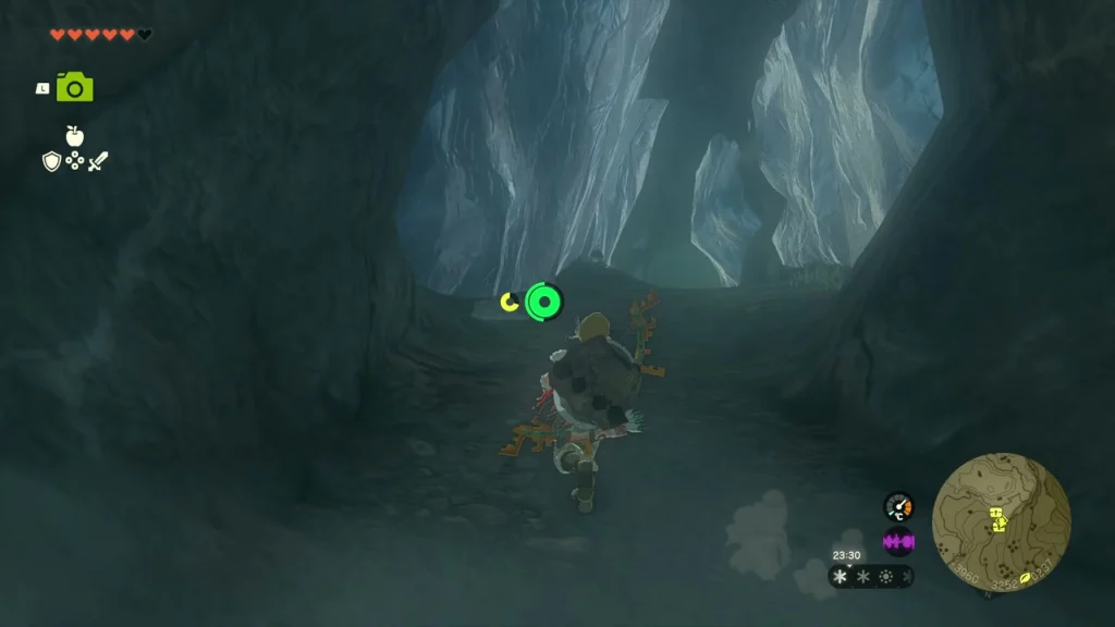Frozen cave mouth with icicles in the snow beside a campfire Frozen cave mouth with icicles in the snow beside a campfire