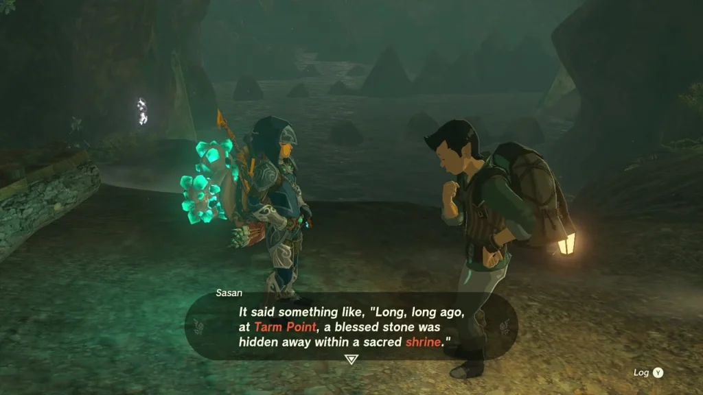 Sasan with a backpack and lantern inside the dark Tarm Point Cave