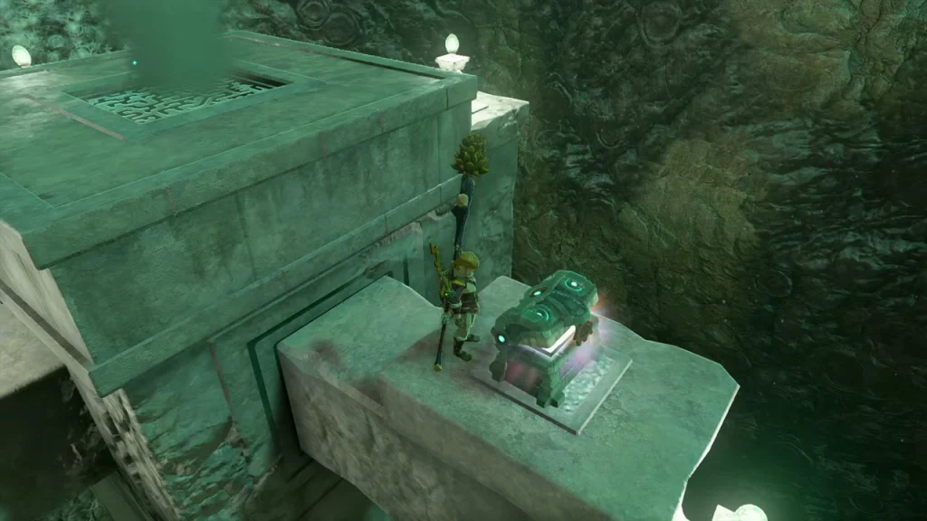 Chest glowing open on a stone block above the mine floor Chest glowing open on a stone block above the mine floor