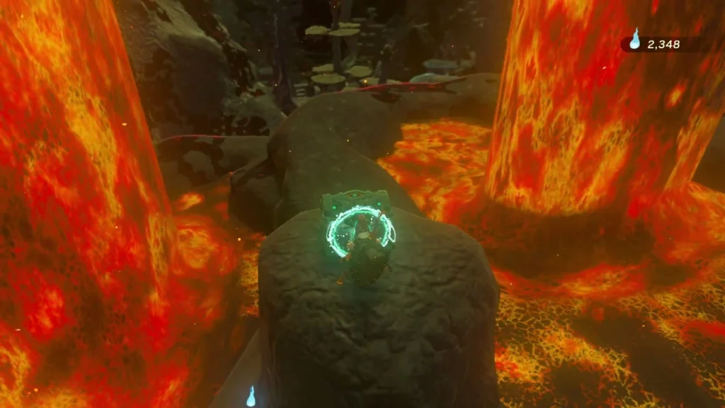 Round rock pillar between two lavafalls where the Goflam chest waits Round rock pillar between two lavafalls where the Goflam chest waits