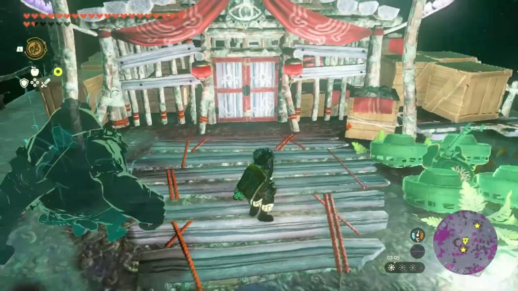 Red-and-white Yiga camp gate on the stone ledge