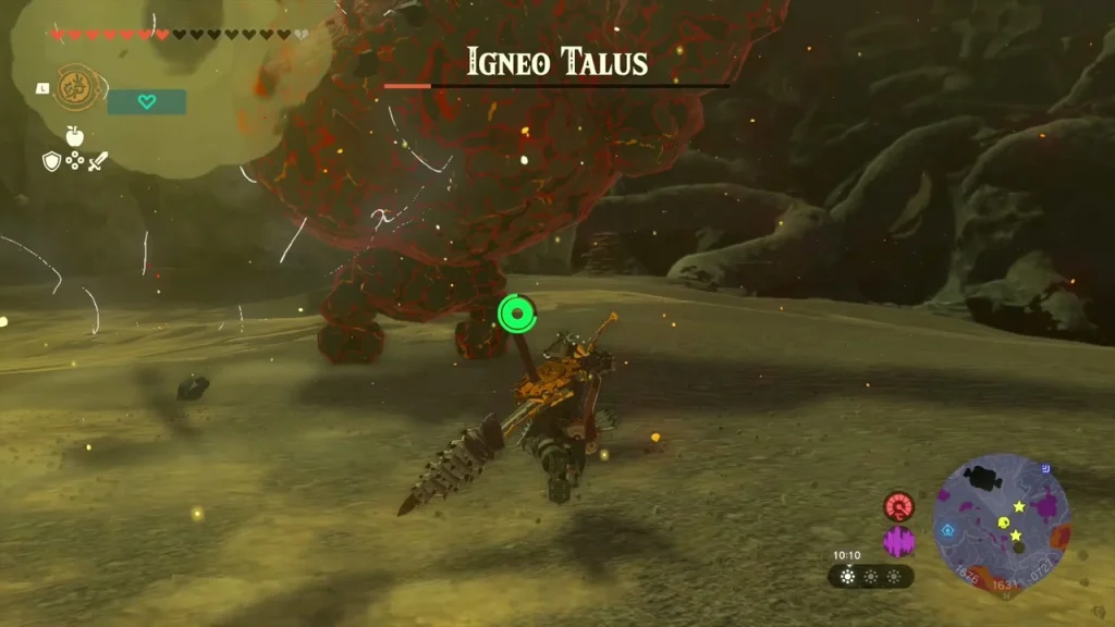 Igneo Talus struck with a drill-tipped weapon above the sandy floor Igneo Talus struck with a drill-tipped weapon above the sandy floor