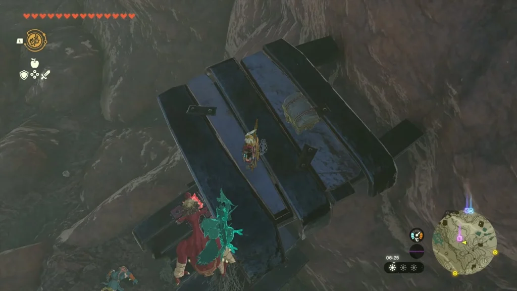 Chest pinned under a stack of dark timber beams on a canyon ledge Chest pinned under a stack of dark timber beams on a canyon ledge