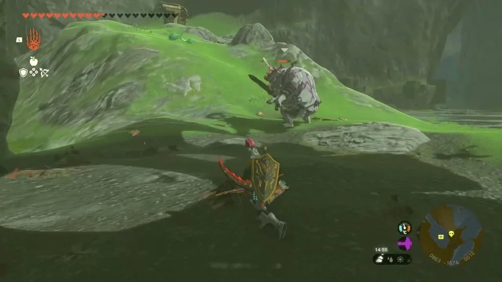 Large Boss Bokoblin facing off on a rocky grass ledge above the lake Large Boss Bokoblin facing off on a rocky grass ledge above the lake