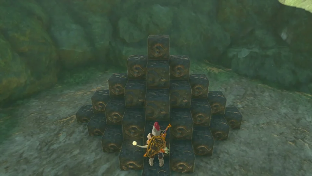 Stack of dark stone cubes arranged into a pyramid pattern Stack of dark stone cubes arranged into a pyramid pattern