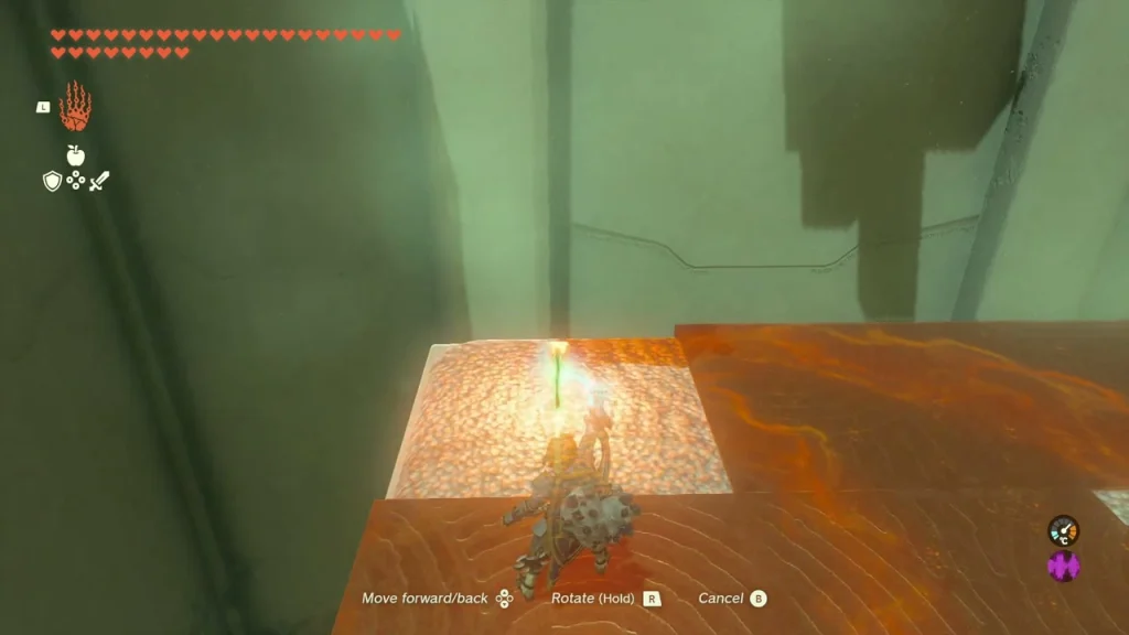 Lit candle placed on a light-colored floor tile between lava-coloured panels Lit candle placed on a light-colored floor tile between lava-coloured panels
