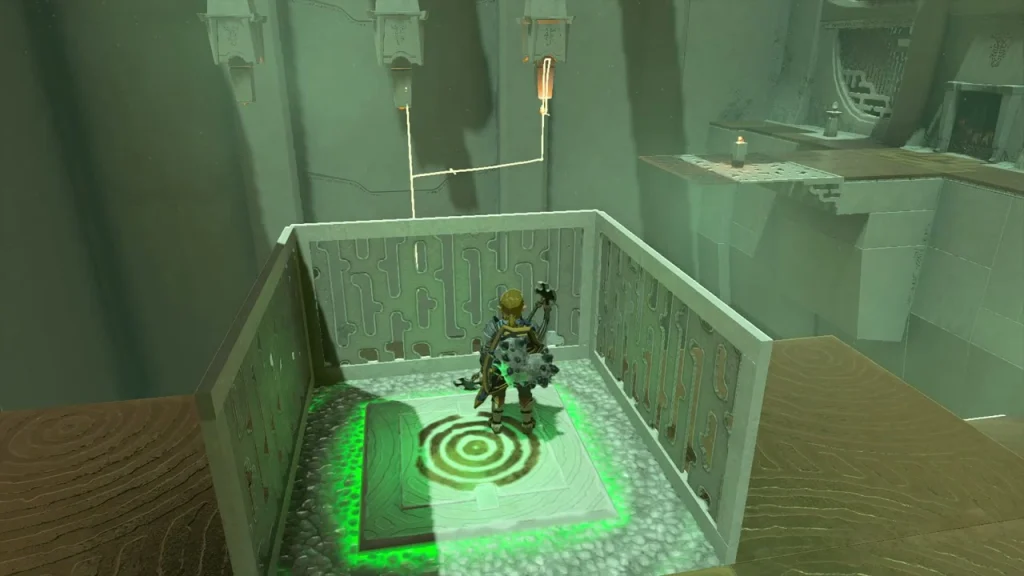 Bullseye switch glowing green after being triggered, with the cord lowering the platform Bullseye switch glowing green after being triggered, with the cord lowering the platform