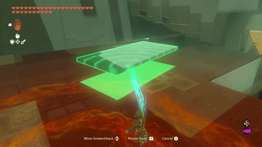 Stone slab held with Ultrahand above a lava-red floor beside the spinning gear Stone slab held with Ultrahand above a lava-red floor beside the spinning gear