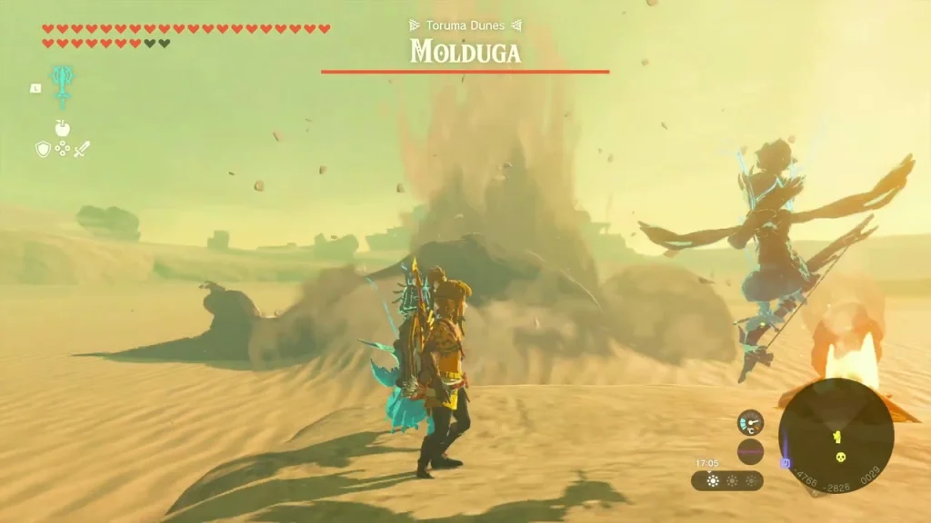 Molduga bursting out of the sand in the Toruma Dunes while a fire arrow is loosed at it Molduga bursting out of the sand in the Toruma Dunes while a fire arrow is loosed at it