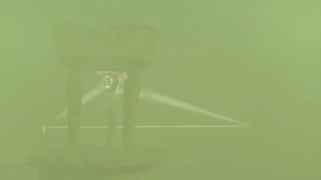 Mirror pillar casting beams into a triangle over the sand