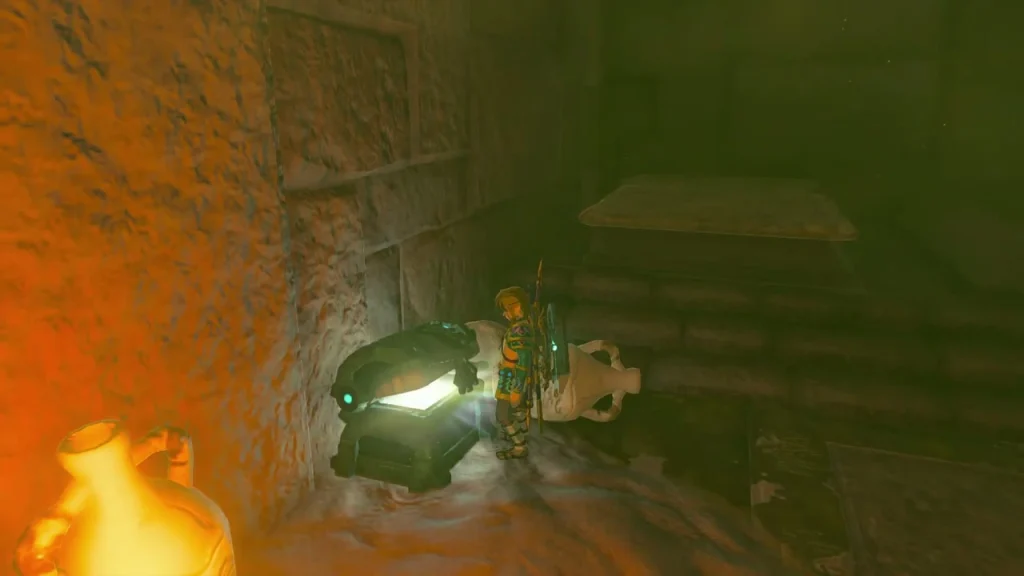 Chest beside a lit torch inside the Lightning Temple