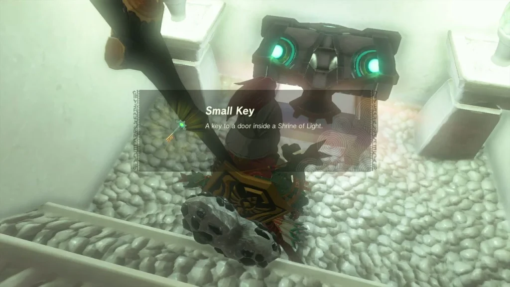 Small Key in a chest sunk in a lit floor pit of Kikakin Shrine