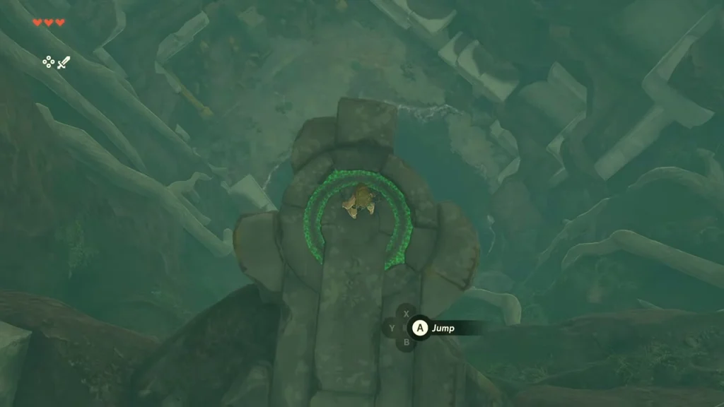 Stone pillar with a Jump prompt above the dark pool in the Room of Awakening Stone pillar with a Jump prompt above the dark pool in the Room of Awakening