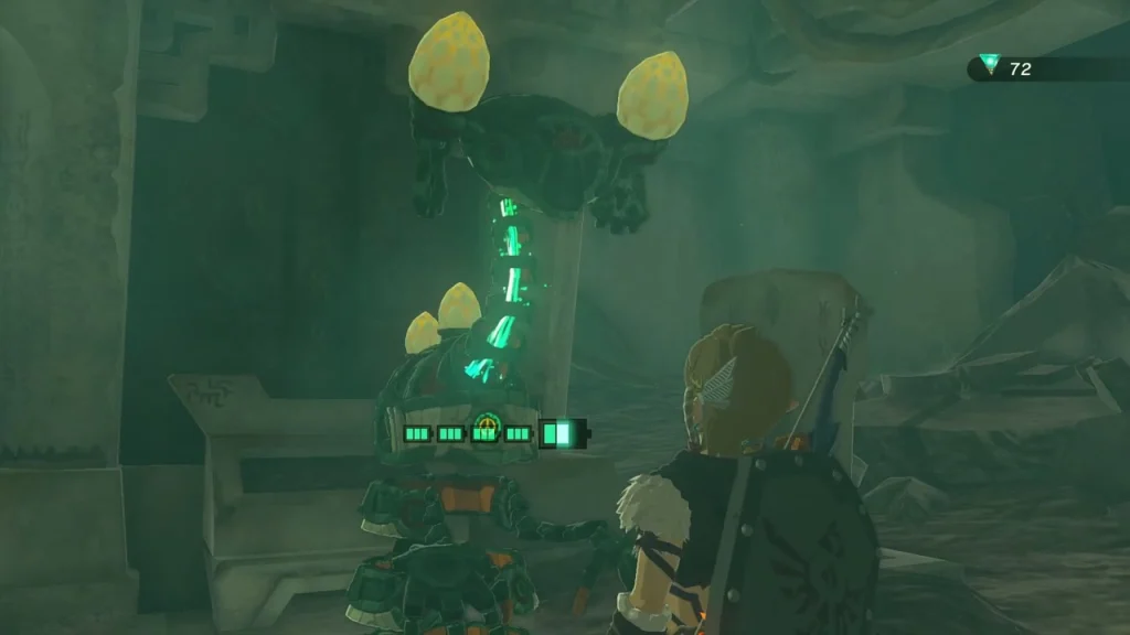 Steward Construct with glowing green parts beside the well Steward Construct with glowing green parts beside the well
