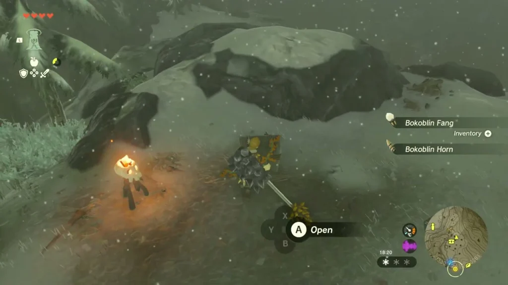 Campfire and chest in a snowy hollow on the route to the summit Campfire and chest in a snowy hollow on the route to the summit