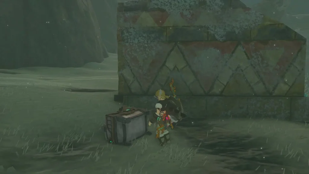 Zonai cart chest standing against a patterned ruin wall Zonai cart chest standing against a patterned ruin wall